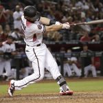 Arizona Diamondbacks' Chris Owings (16) connects for a game-tying, 3-run home run against the Los Angeles Dodgers during the ninth inning of a baseball game, Monday, April 2, 2018, in Phoenix. (AP Photo/Matt York)