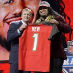 Washington's Vita Vea, right, poses with commissioner Roger Goodell after being picked by the Tampa Bay Buccaneers during the first round of the NFL football draft, Thursday, April 26, 2018, in Arlington, Texas. (AP Photo/David J. Phillip)