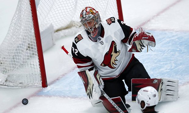 Arizona Coyotes goalie Antti Raanta, of Finland, reacts after letting in a goal off the stick of Co...