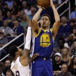 Golden State Warriors guard Klay Thompson (11) shoots over Phoenix Suns guard Tyler Ulis in the first half during an NBA basketball game, Sunday, April 8, 2018, in Phoenix. (AP Photo/Rick Scuteri)