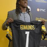 Pittsburgh Steelers first-round NFL football draft pick Terrell Edmunds holds up a jersey after a news conference at the team's headquarters in Pittsburgh, Friday, April 27, 2018. (AP Photo/Fred Vuich) )