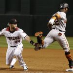Arizona Diamondbacks first baseman Paul Goldschmidt (44) tags out San Francisco Giants' Andrew McCutchen, right, at first base during the fifth inning of a baseball game Wednesday, April 18, 2018, in Phoenix. (AP Photo/Ross D. Franklin)