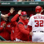 Washington Nationals catcher Matt Wieters (32) high-fives teammates after hitting a home run during the second inning of a baseball game against the Arizona Diamondbacks at Nationals Park, Sunday, April 29, 2018, in Washington. (AP Photo/Andrew Harnik)
