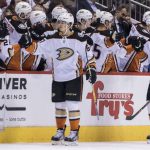 Anaheim Ducks' Rickard Rakell, front left, gets high-fives from the bench after scoring against the Phoenix Coyotes during the second period of an NHL hockey game Saturday, April 7, 2018, in Glendale, Ariz. (AP Photo/Darryl Webb