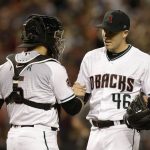 Arizona Diamondbacks starting pitcher Patrick Corbin (46) celebrates with Alex Avila after pitching a complete game, one hit shut-out against the San Francisco Giants during a baseball game, Tuesday, April 17, 2018, in Phoenix. (AP Photo/Rick Scuteri)