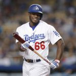 Los Angeles Dodgers' Yasiel Puig reacts after striking out during the first inning of the team's baseball game against the Arizona Diamondbacks, Friday, April 13, 2018, in Los Angeles. (AP Photo/Jae C. Hong)