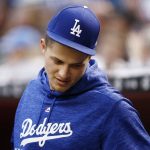 An injured Los Angeles Dodgers' Corey Seager stands in the dugout prior to a baseball game against the Arizona Diamondbacks Monday, April 30, 2018, in Phoenix. (AP Photo/Ross D. Franklin)
