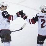 Arizona Coyotes' Dylan Strome, left, celebrates his goal with Oliver Ekman-Larsson, of Sweden, during the second period of an NHL hockey game against the Vancouver Canucks on Thursday, April 5, 2018, in Vancouver, British Columbia. (Darryl Dyck/The Canadian Press via AP)