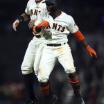 San Francisco Giants' Andrew McCutchen, right, celebrates with Brandon Belt after making the game-winning hit in the ninth inning of a baseball game against the Arizona Diamondbacks, Tuesday, April 10, 2018, in San Francisco. The Giants won 5-4. (AP Photo/Ben Margot)