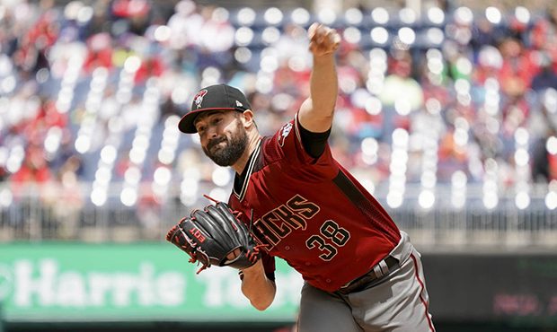 Arizona Diamondbacks starting pitcher Robbie Ray (38) pitches during the first inning of a baseball...