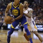 Golden State Warriors guard Shaun Livingston (34) gets pressured by Phoenix Suns guard Tyler Ulis in the first half during an NBA basketball game, Sunday, April 8, 2018, in Phoenix. (AP Photo/Rick Scuteri)