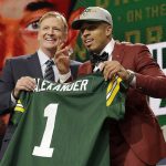 Commissioner Roger Goodell, left, presents Louisville's Jaire Alexander with his Green Bay Packers jersey during the first round of the NFL football draft, Thursday, April 26, 2018, in Arlington, Texas. (AP Photo/David J. Phillip)