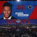 Penn State's Saquon Barkley greets commissioner Roger Goodell on the stage after being selected by the New York Giants during the first round of the NFL football draft, Thursday, April 26, 2018, in Arlington, Texas. (AP Photo/David J. Phillip)