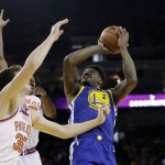 Golden State Warriors' Jordan Bell (2) goes up for a shot against the Phoenix Suns during the first half of an NBA basketball game Sunday, April 1, 2018, in Oakland, Calif. (AP Photo/Marcio Jose Sanchez)