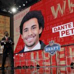 NFL Commissioner Roger Goodell, left, and former player Merton Hanks walk off the stage after announcing Washington's Dante Pettis as the San Francisco 49ers' pick during the second round of the NFL football draft Friday, April 27, 2018, in Arlington, Texas. (AP Photo/Eric Gay)