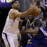Phoenix Suns forward Jared Dudley, left, and Golden State Warriors forward Draymond Green battle for a loose ball in the first half during an NBA basketball game, Sunday, April 8, 2018, in Phoenix. (AP Photo/Rick Scuteri)