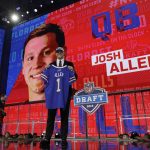 Wyoming's Josh Allen poses with his Buffalo Bills jersey during the first round of the NFL football draft, Thursday, April 26, 2018, in Arlington, Texas. (AP Photo/David J. Phillip)