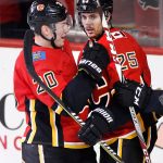 Calgary Flames' Nick Shore (right) celebrates his goal with Curtis Lazar against the Arizona Coyotes during second period NHL hockey action in Calgary, Alberta, Tuesday, April 3, 2018. (Larry MacDougal/The Canadian Press via AP)