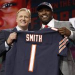Commissioner Roger Goodell, left, presents Georgia's Roquan Smith with his Chicago Bears jersey during the first round of the NFL football draft, Thursday, April 26, 2018, in Arlington, Texas. (AP Photo/David J. Phillip)