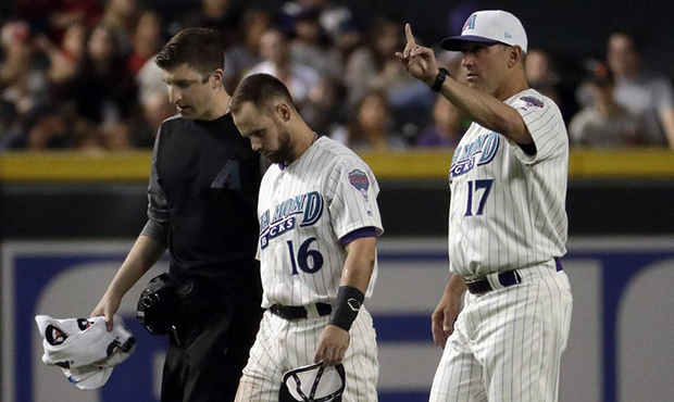 Arizona Diamondbacks manager Torey Lovullo (17) signals for a replacement during the third inning o...