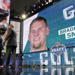 Joseph Addai, left, and NFL Commissioner Roger Goodell, right, announce Auburn's Braden Smith as as a selection by the Indianapolis Colts during the second round of the football league's draft Friday, April 27, 2018, in Arlington, Texas. (AP Photo/Eric Gay)
