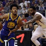 Golden State Warriors guard Quinn Cook (4) drives past Phoenix Suns guard Troy Daniels in the first half during an NBA basketball game, Sunday, April 8, 2018, in Phoenix. (AP Photo/Rick Scuteri)