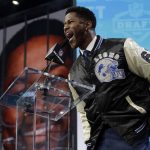 Former player Nate Burleson announces Auburn's Kerryon Johnson as the Detroit Lions' pick during the second round of the NFL football draft Friday, April 27, 2018, in Arlington, Texas. (AP Photo/Eric Gay)