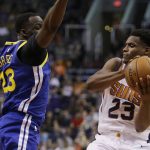 Phoenix Suns forward Danuel House Jr. (23) drives past Golden State Warriors forward Draymond Green in the second half during an NBA basketball game, Sunday, April 8, 2018, in Phoenix. The Warriors defeated the Suns 117-100. (AP Photo/Rick Scuteri)