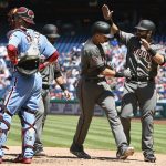 
              Arizona Diamondbacks' Nick Ahmed, second from right, is congratulated by Alex Avila, right, after Ahmed hit a three-run home run off Philadelphia Phillies' Ben Lively during the third inning of a baseball game, Thursday, April 26, 2018, in Philadelphia. (AP Photo/Derik Hamilton)
            