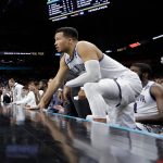 Villanova's Jalen Brunson watches from the bench during the second half in the championship game of the Final Four NCAA college basketball tournament against Michigan, Monday, April 2, 2018, in San Antonio. (AP Photo/David J. Phillip)