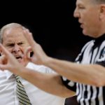 Michigan head coach John Beilein, left, reacts to a call against his team during the second half against Villanova in the championship game of the Final Four NCAA college basketball tournament, Monday, April 2, 2018, in San Antonio. (AP Photo/David J. Phillip)