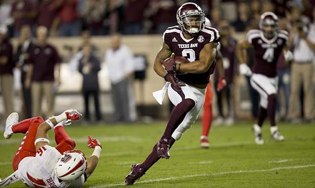 Texas A&M wide receiver Christian Kirk (3) breaks away from New Mexico safety Jacob Girgle (16)...