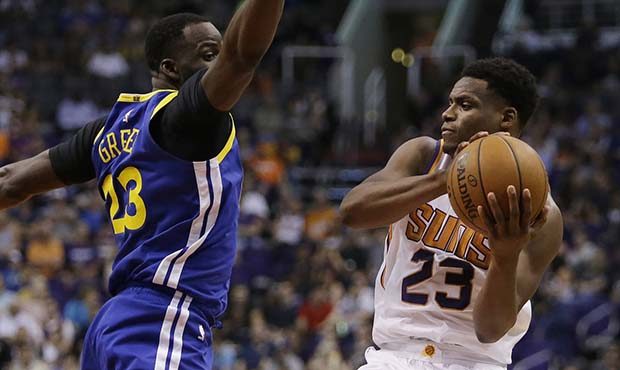 Phoenix Suns forward Danuel House Jr. (23) drives past Golden State Warriors forward Draymond Green...