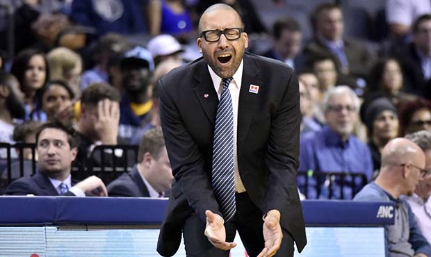 Memphis Grizzlies head coach David Fizdale reacts in the second half of an NBA basketball game agai...