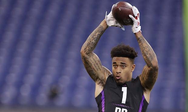 Louisville defensive back Jaire Alexander runs a drill at the NFL football scouting combine in Indi...