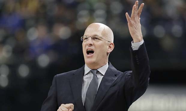 Phoenix Suns interim coach Jay Triano argues a call during the first half of an NBA basketball game...