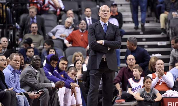 Phoenix Suns interim coach Jay Triano watches during the second half of the team's NBA basketball g...