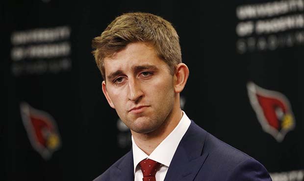 Arizona Cardinals first-round NFL football draft pick Josh Rosen pauses as he listens to a question...