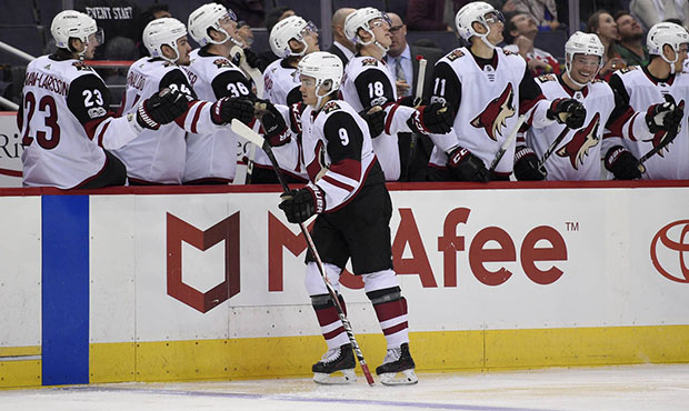 Arizona Coyotes center Clayton Keller (9) celebrates his goal with the bench during the first perio...
