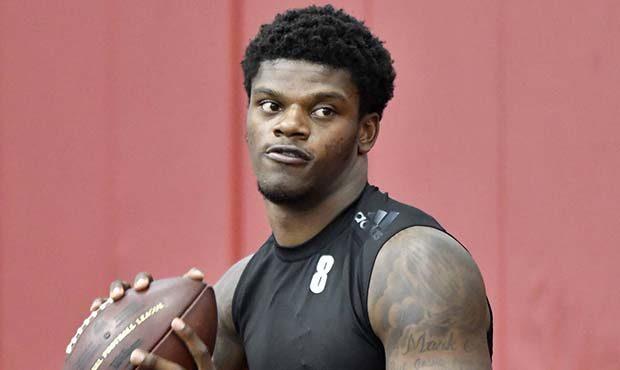 Lamar Jackson warms up before his workout in front of NFL scouts during Louisville's football Pro D...