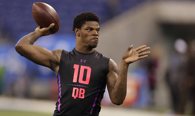 Louisville quarterback Lamar Jackson runs a drill at the NFL football scouting combine in Indianapo...