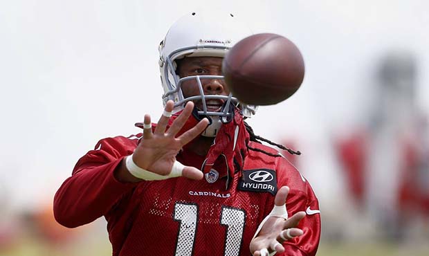Arizona Cardinals wide receiver Larry Fitzgerald makes a catch as players run drills during a volun...
