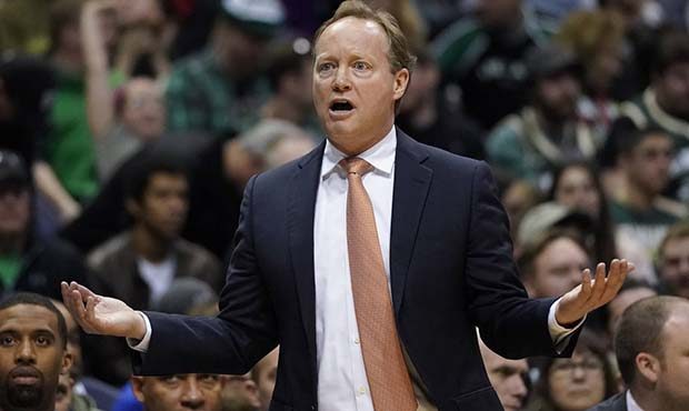 Atlanta Hawks head coach Mike Budenholzer reacts during the first half of an NBA basketball game ag...
