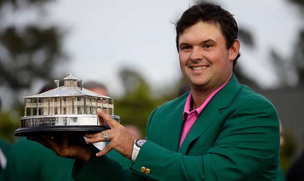 Patrick Reed holds the championship trophy after winning the Masters golf tournament Sunday, April ...