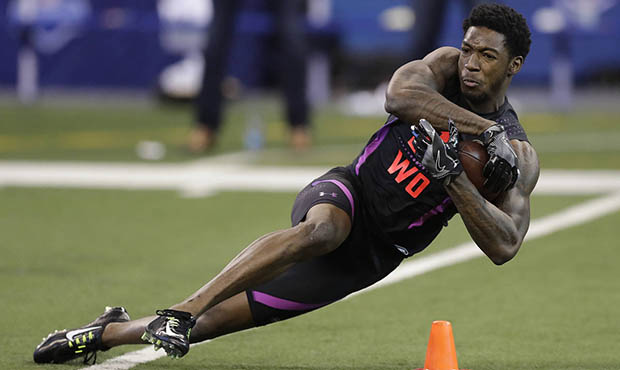 Alabama wide receiver Calvin Ridley runs a drill during the NFL football scouting combine, Saturday...
