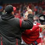 St. Louis Cardinals catcher Yadier Molina, right, throws off his mask as he argues with Arizona Diamondbacks manager Torey Lovullo during an altercation in the second inning of a baseball game Sunday, April 8, 2018, in St. Louis. (AP Photo/Jeff Roberson)