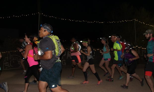 10-Kilometer race participants take off into the night. The 10K race started at approximately 8 p.m...