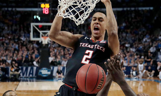 Texas Tech's Zhaire Smith, top, dunks against Villanova during the second half of an NCAA men's col...