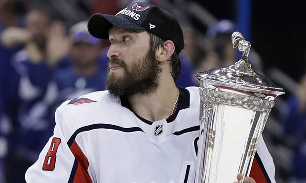 Washington Capitals left wing Alex Ovechkin (8) holds the Prince of Wales trophy after the Capitals...