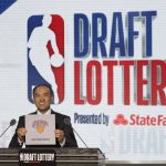 NBA Deputy Commissioner Mark Tatum announces that the New York Knicks had won the ninth pick during the NBA basketball draft lottery Tuesday, May 15, 2018, in Chicago. (AP Photo/Charles Rex Arbogast)